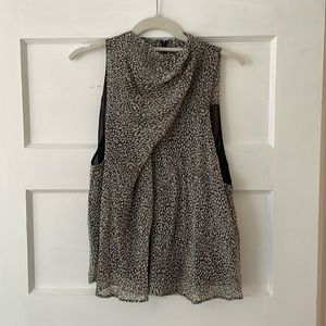 High neck, sleeveless blouse